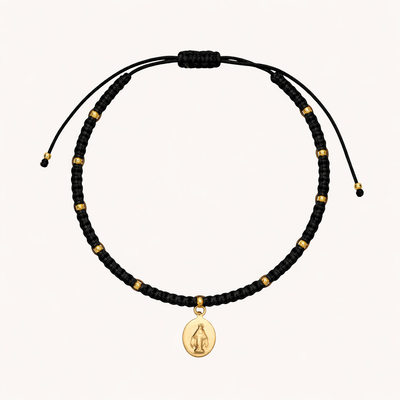 PULSERA DE HILO NEGRO TEJIDO VIRGEN DE LOS RAYOS BAÑO EN ORO