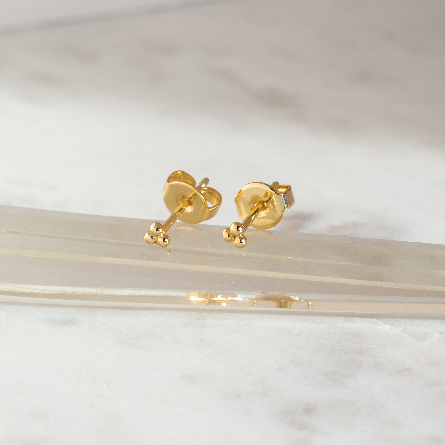 PIERCING IRIS BAÑO DE ORO